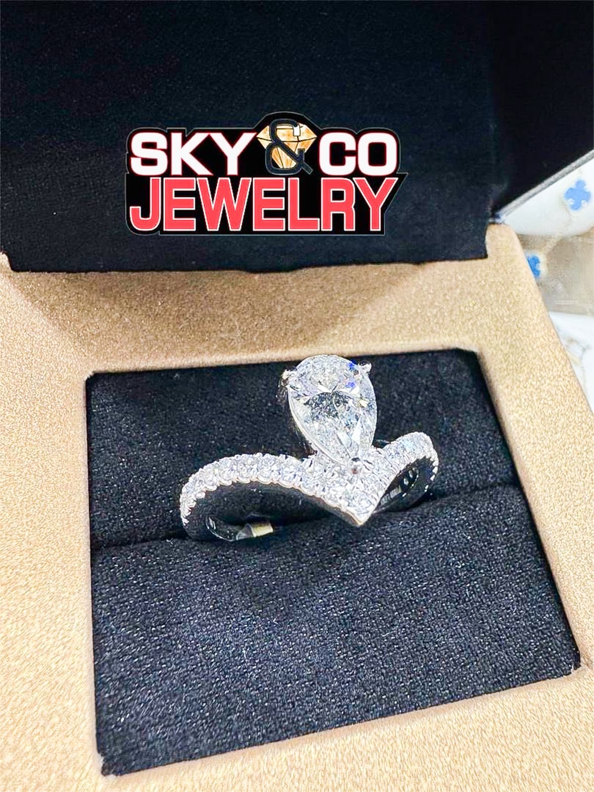 Elegant diamond snake-shaped ring in a Main & Stone presentation box