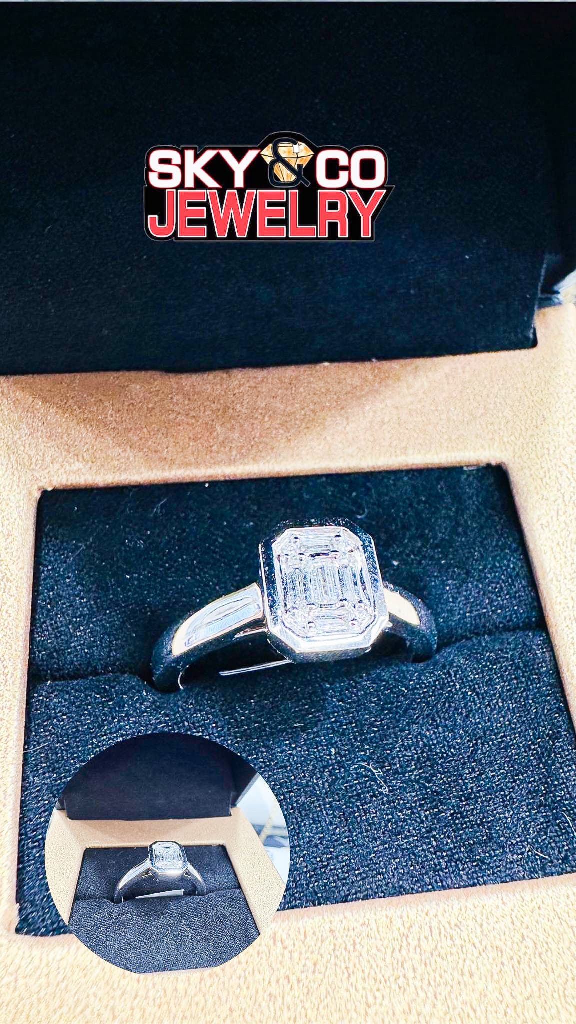 Classic emerald-cut diamond solitaire engagement ring in a Main & Stone presentation box